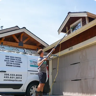 technician cleaning windows