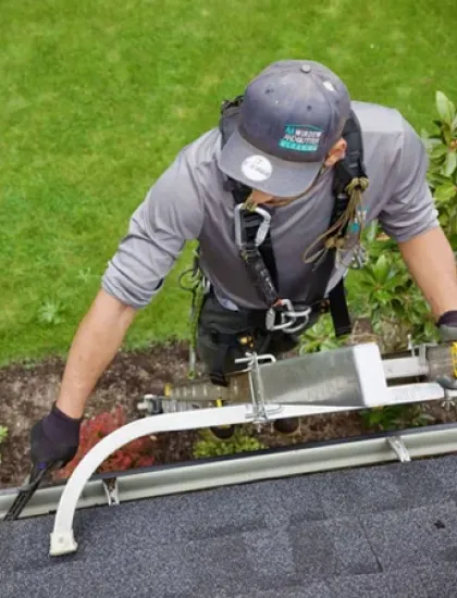 cleaning gutters on a house